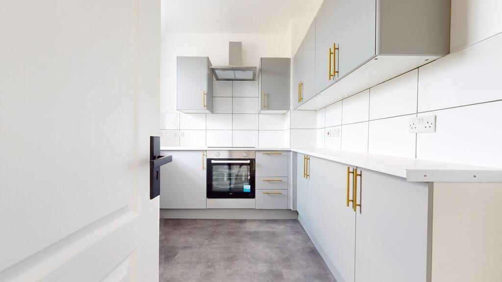 Bright and modern kitchen featuring sleek grey ...