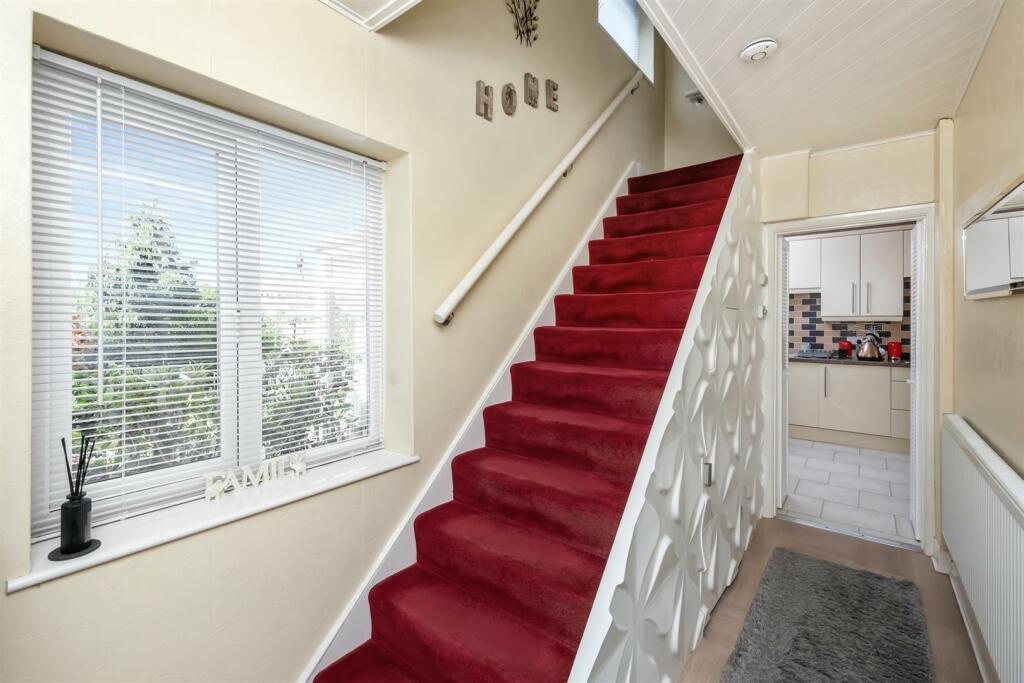 Stairs rising to First Floor