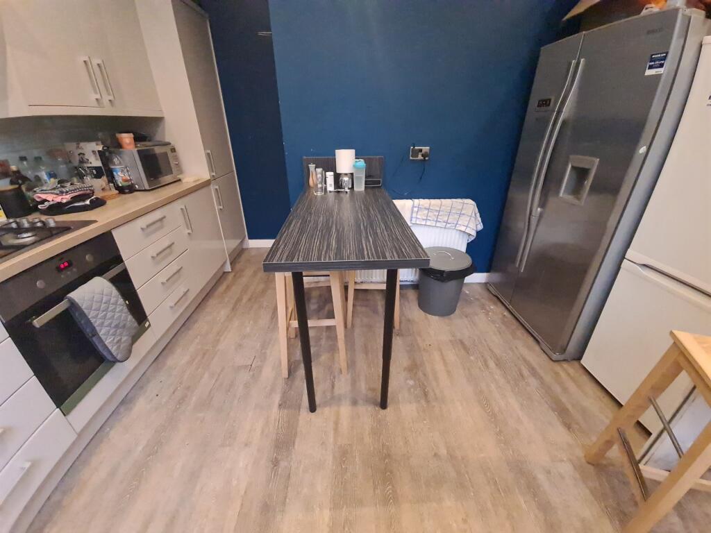 Contemporary kitchen featuring a large stainles...