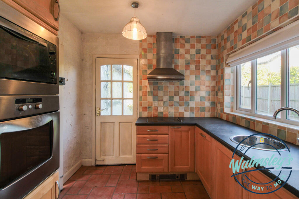 Kitchen with door to gardens
