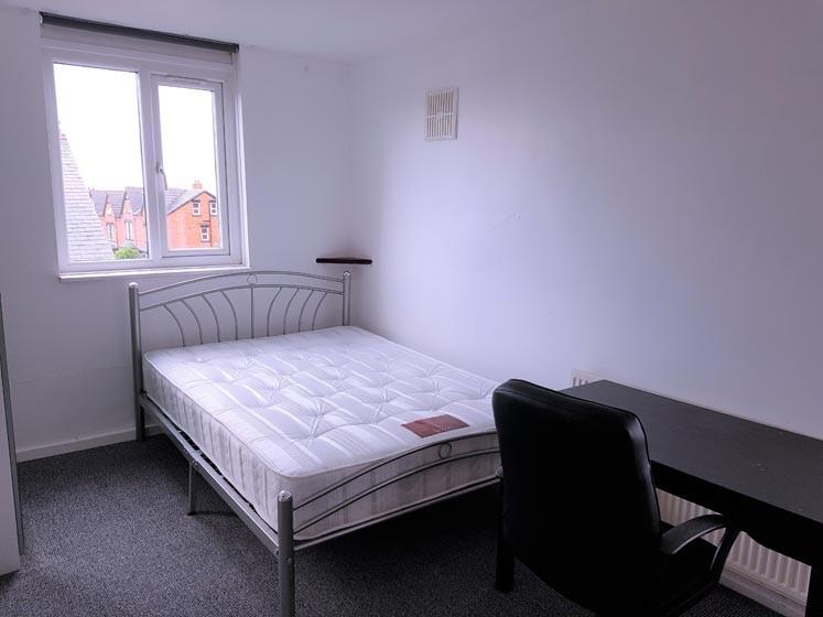 A well-maintained single bedroom featuring a co...