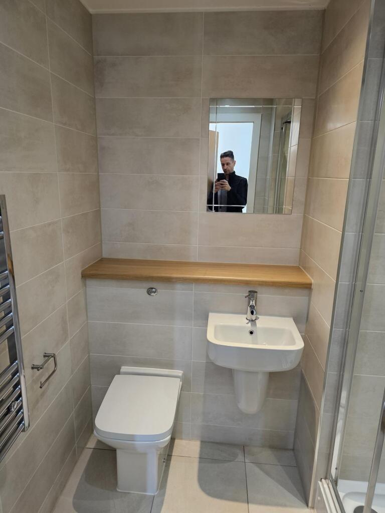 A modern, well-maintained bathroom featuring a ...