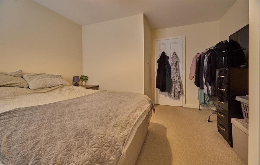 BEDROOM ONE TO FRONT