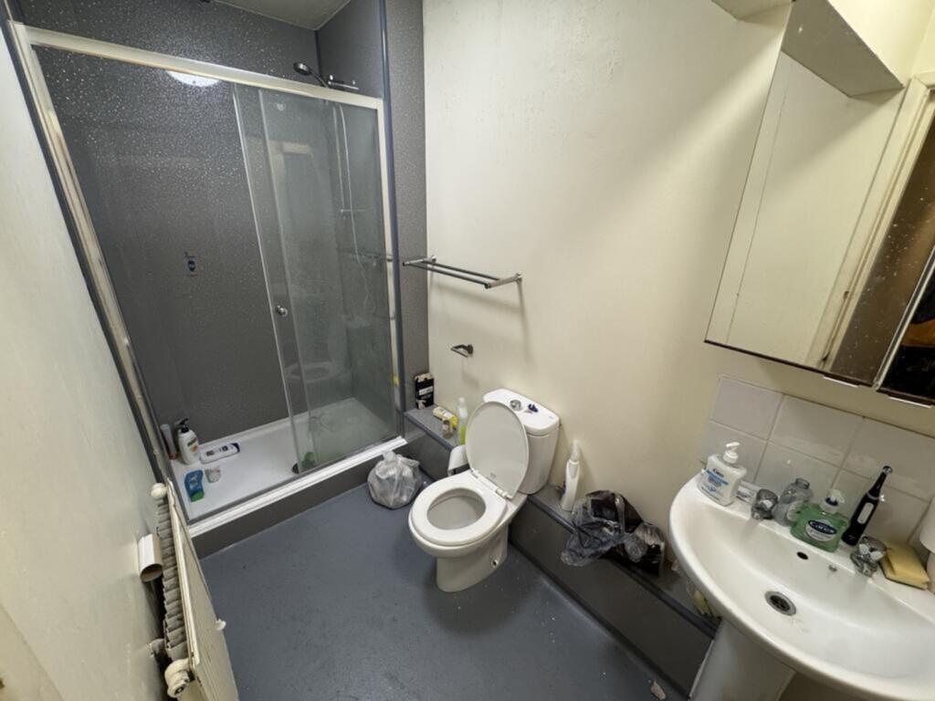 A well-equipped bathroom featuring a spacious s...