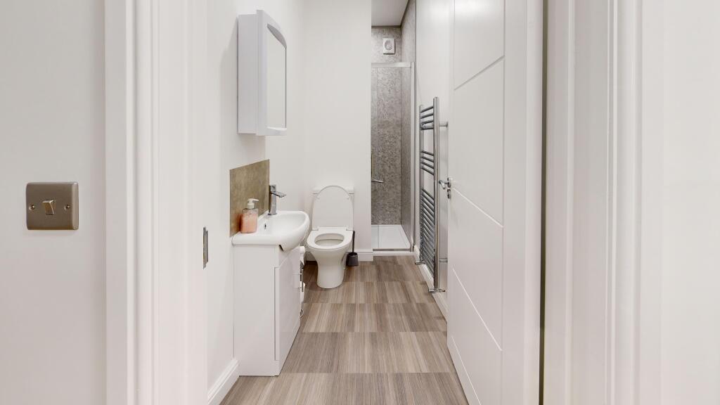 A modern bathroom featuring sleek fixtures and ...
