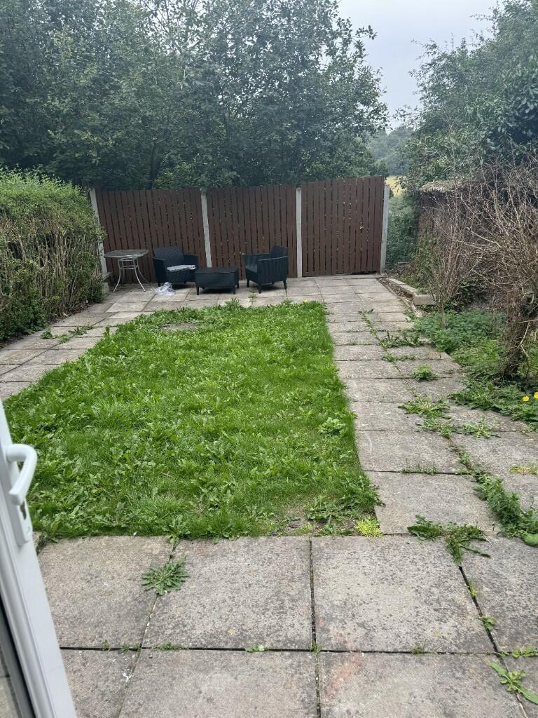 A pleasant outdoor garden area featuring a cent...