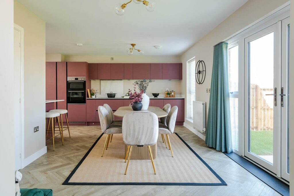 Double doors lead from the dining area to the garden, perfect for alfresco dining