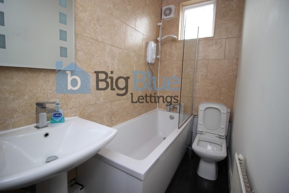 Bright and modern bathroom featuring a clean wh...