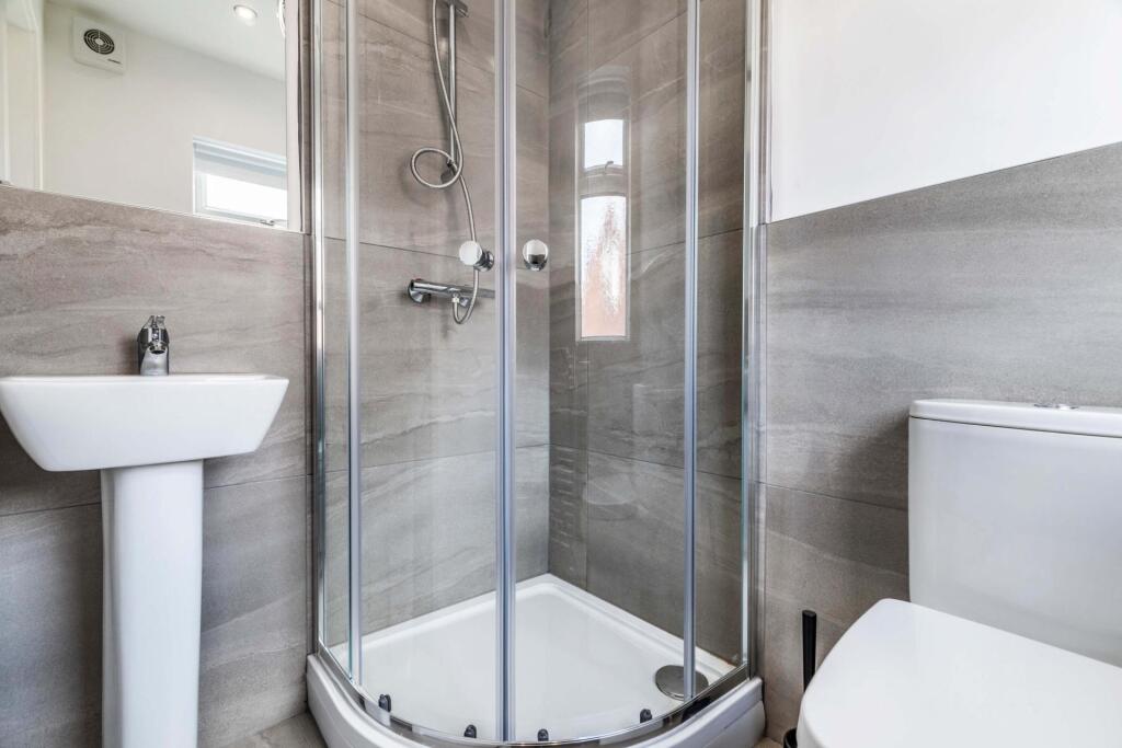 A well-maintained modern bathroom featuring a s...