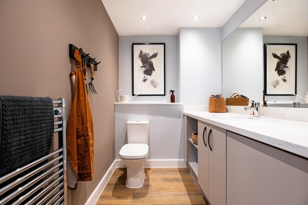 A downstairs toilet and utility room adds convenience