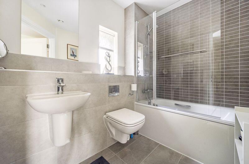 Bathroom with over-bath shower