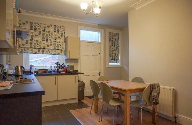 A bright and functional kitchen featuring ample...