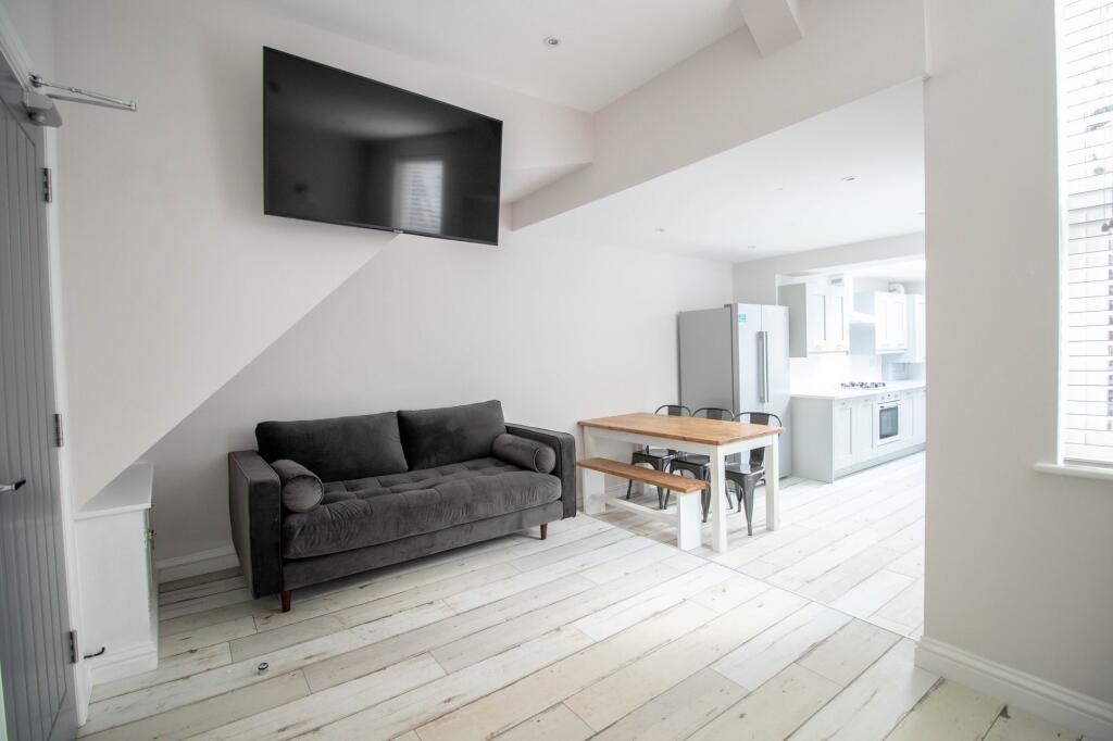 Bright and contemporary living room with a larg...
