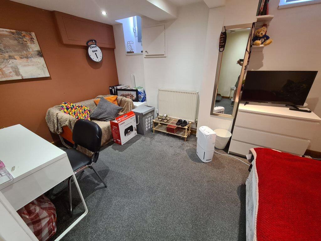 A neat and functional small room featuring a co...