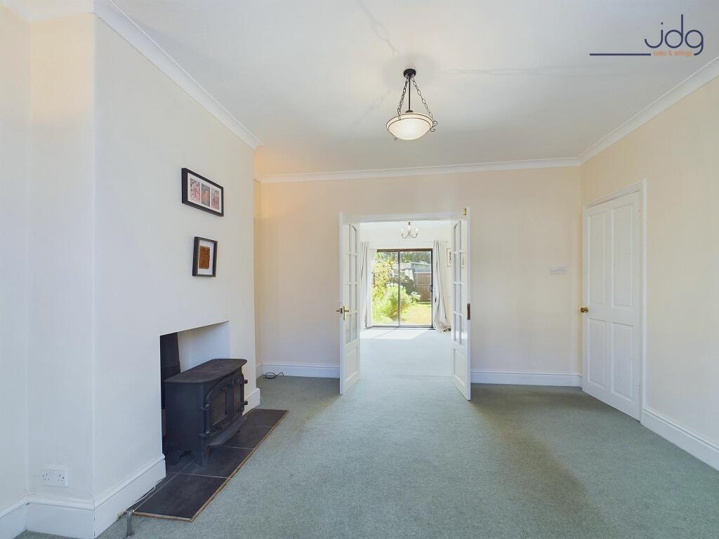 The lounge has double doors to the dining room