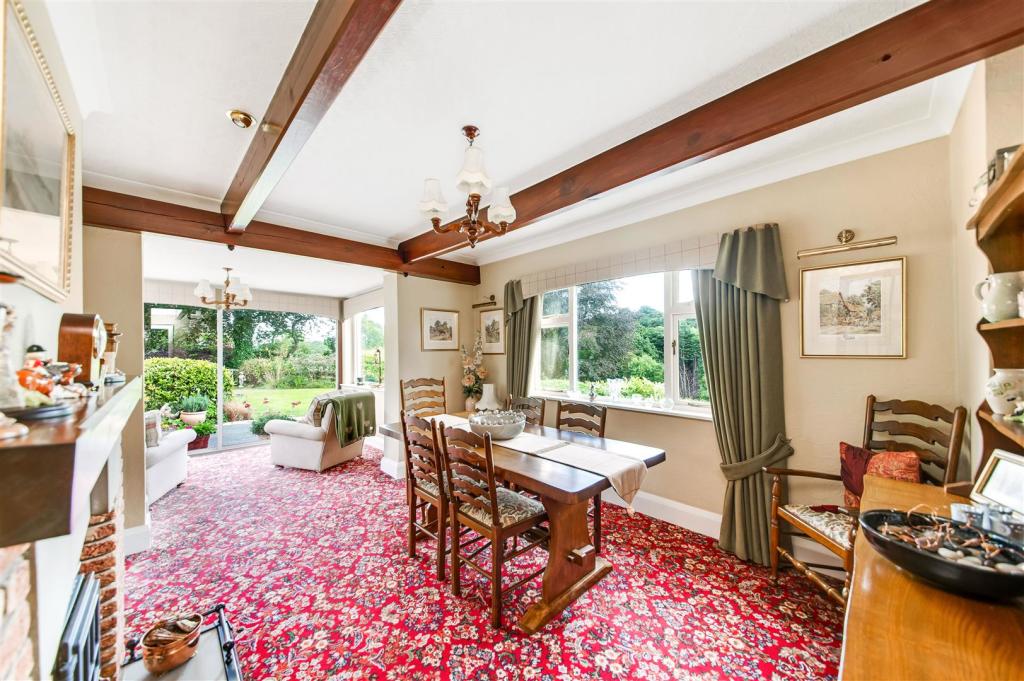 DINING ROOM WITH SUN ROOM ADJOINING