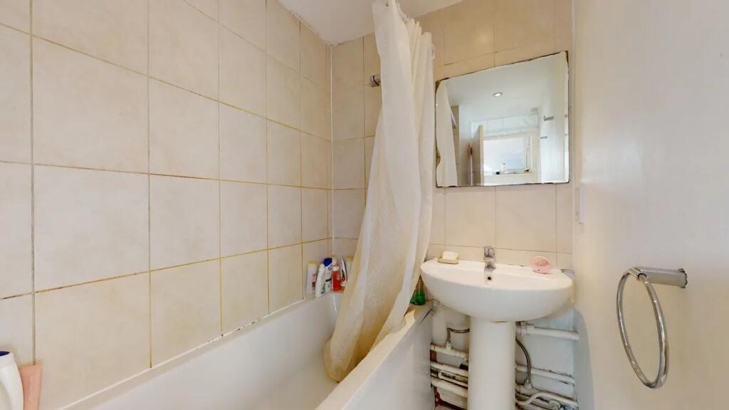 Bright bathroom suite featuring a full bath wit...