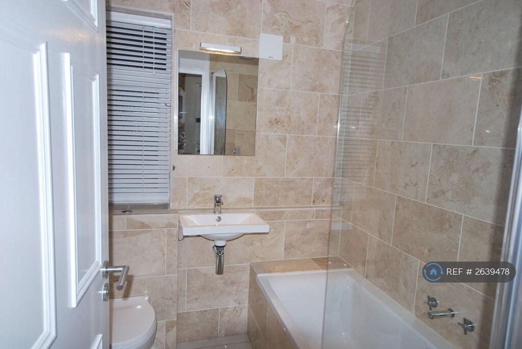 Fully Tiled Bathroom With Heated Towel Radiator