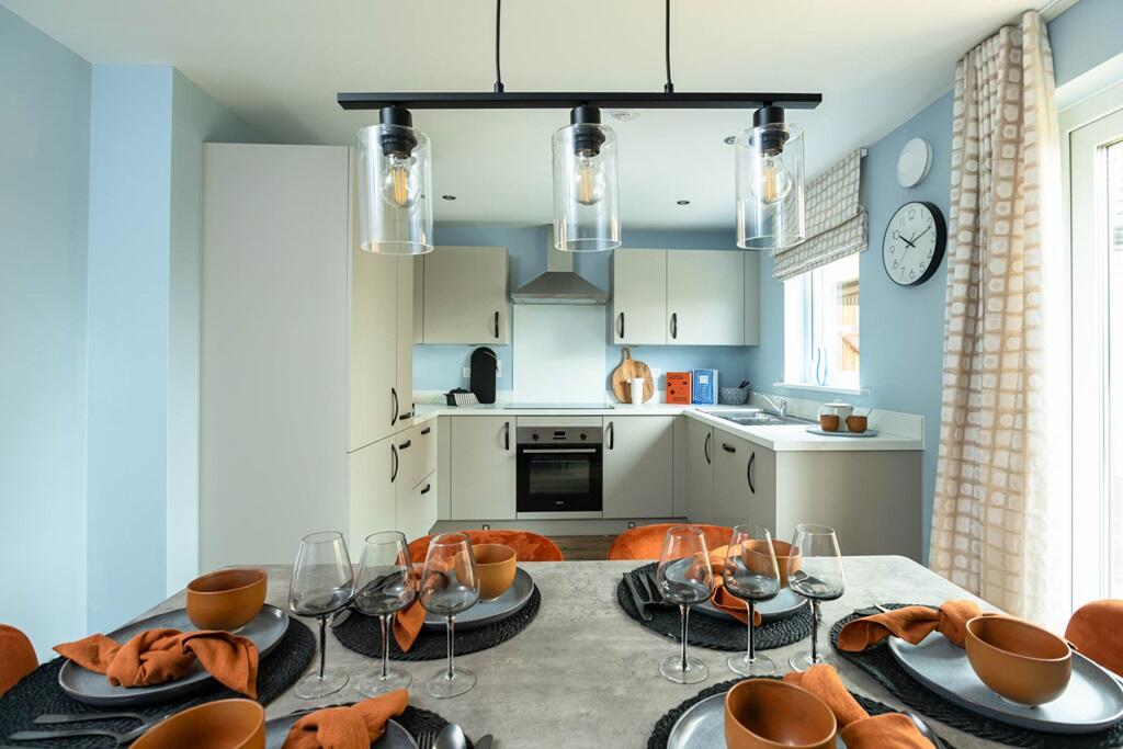 The kitchen/dining area features French doors to the rear garden