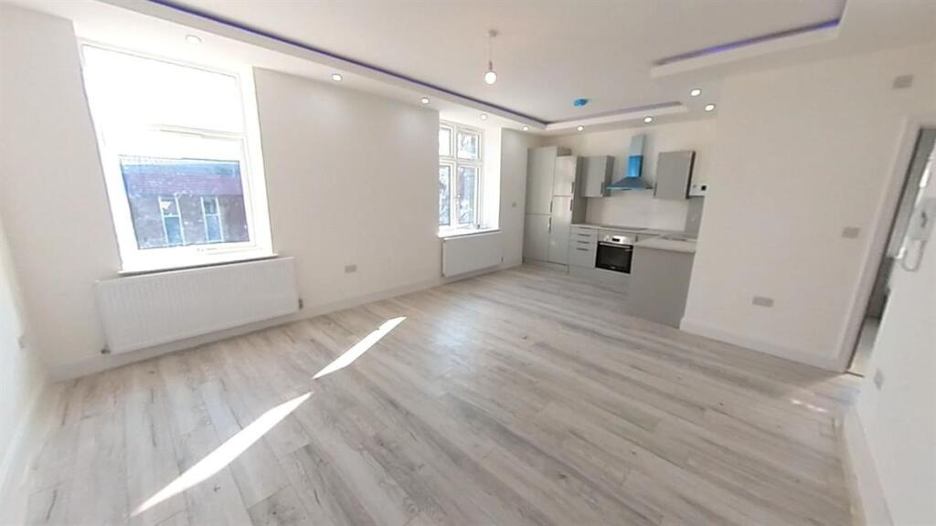 Bright and spacious contemporary living room fe...