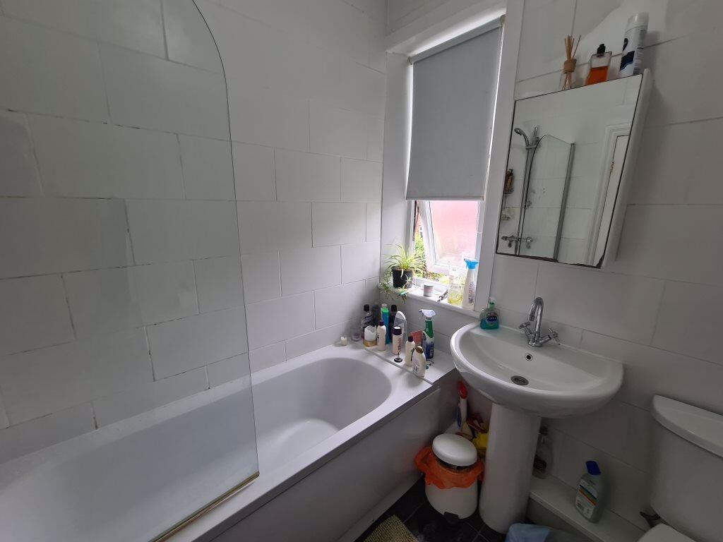 A well-maintained bathroom featuring a classic ...