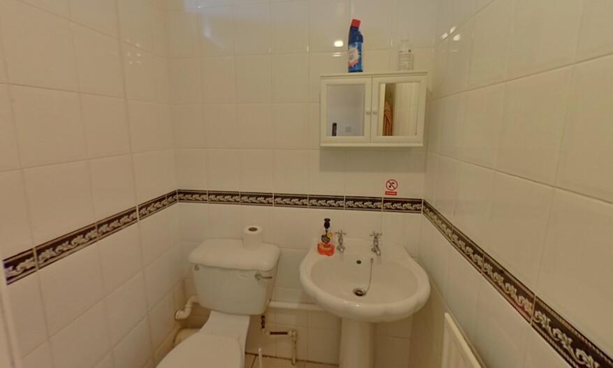 A clean and well-maintained single toilet with ...