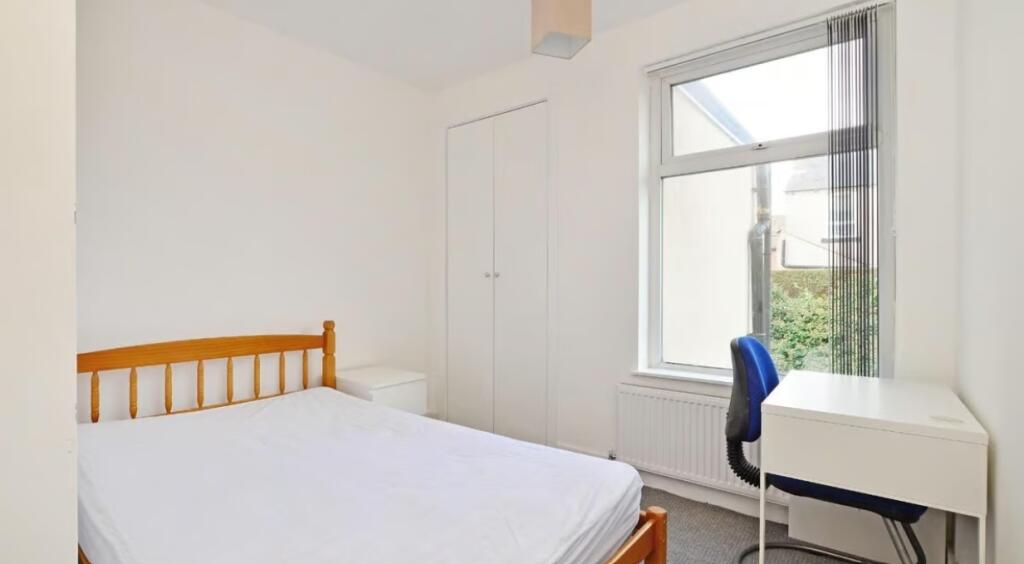 Bright and inviting double bedroom featuring a ...