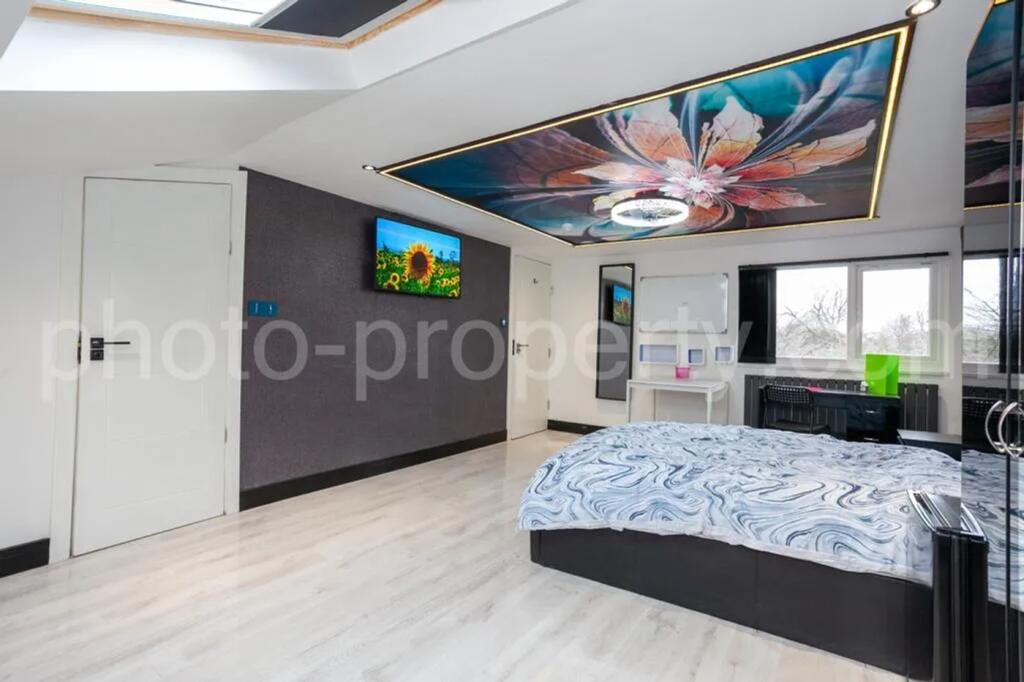 Experience luxury in this spacious master bedro...