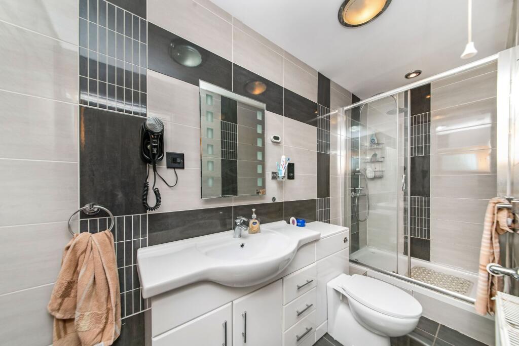 BEDROOM ONE EN-SUITE SHOWER ROOM