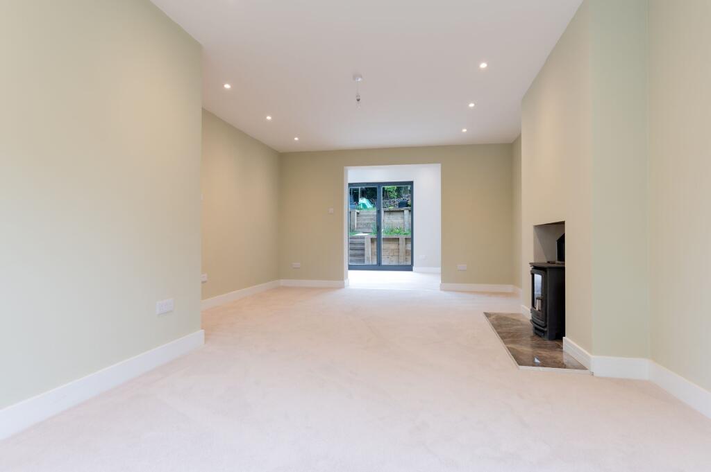 Light and spacious lounge with log burner