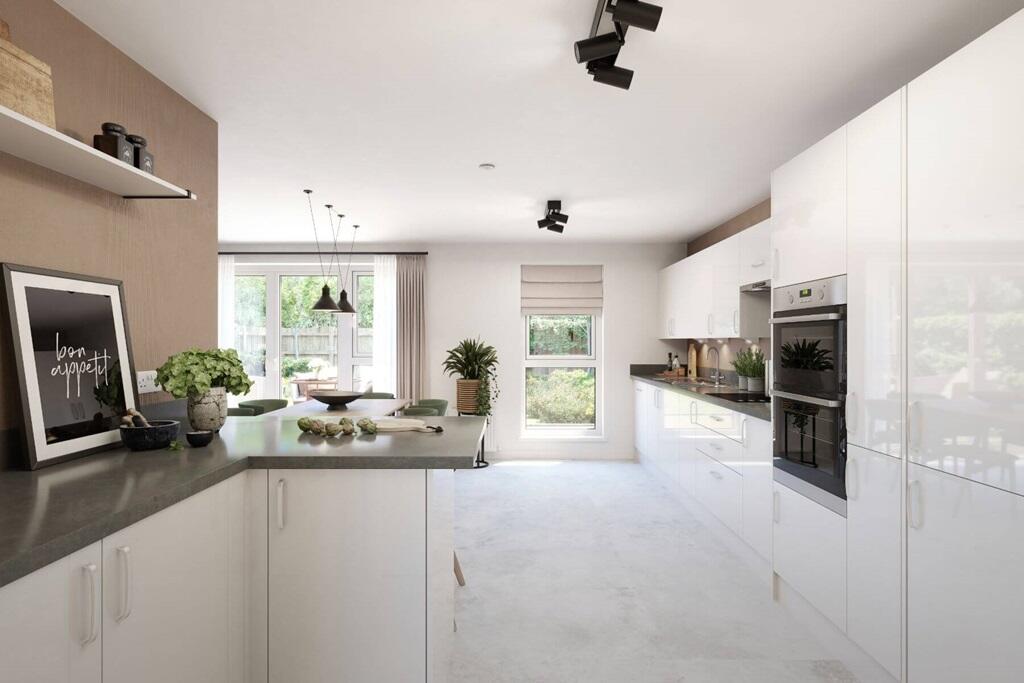 The kitchen benefits from ample storage