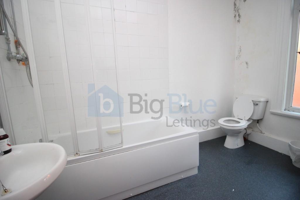A bright and functional bathroom featuring a ba...