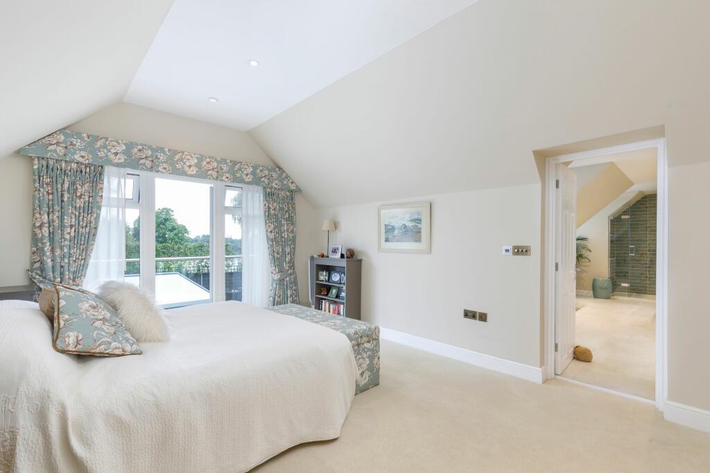 Principle bedroom with vaulted ceiling