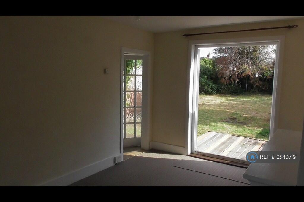 Large Living Room Opens To Decking And Patio