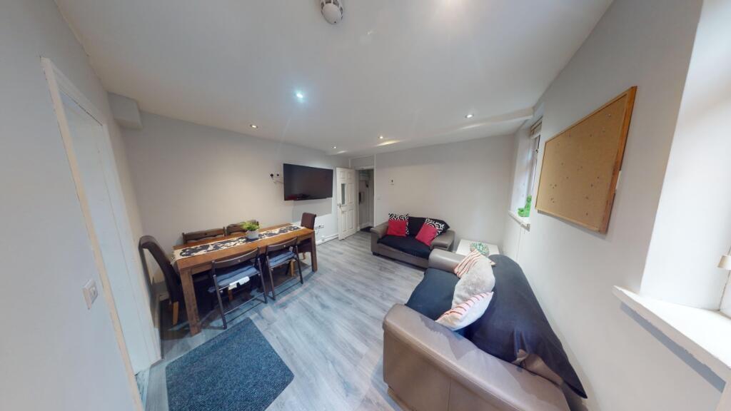 A cozy and modern living room featuring comfort...