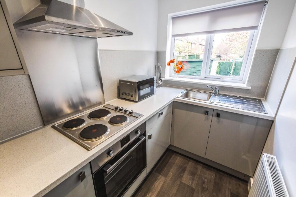 This well-appointed kitchen features modern app...