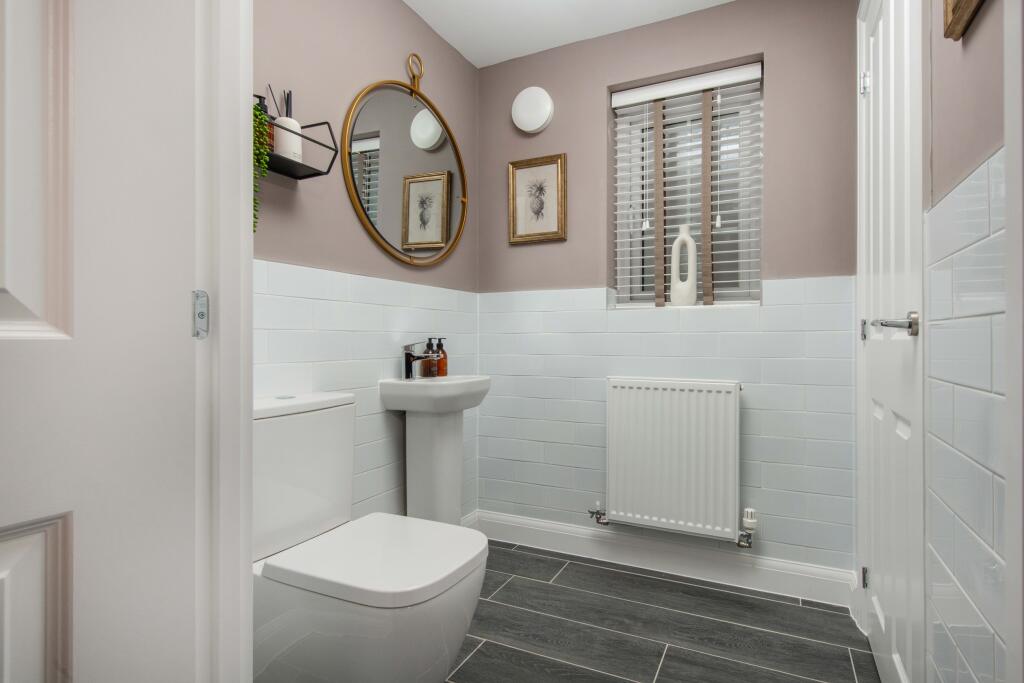 Holden WE with white tiling and pink walls