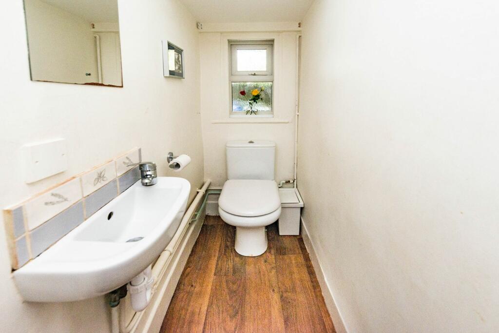 CLOAK ROOM HALLWAY AND LANDING