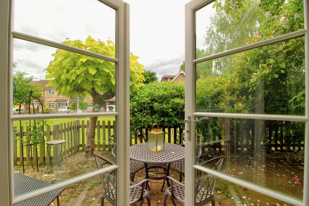 View from French doors, showing residents' green