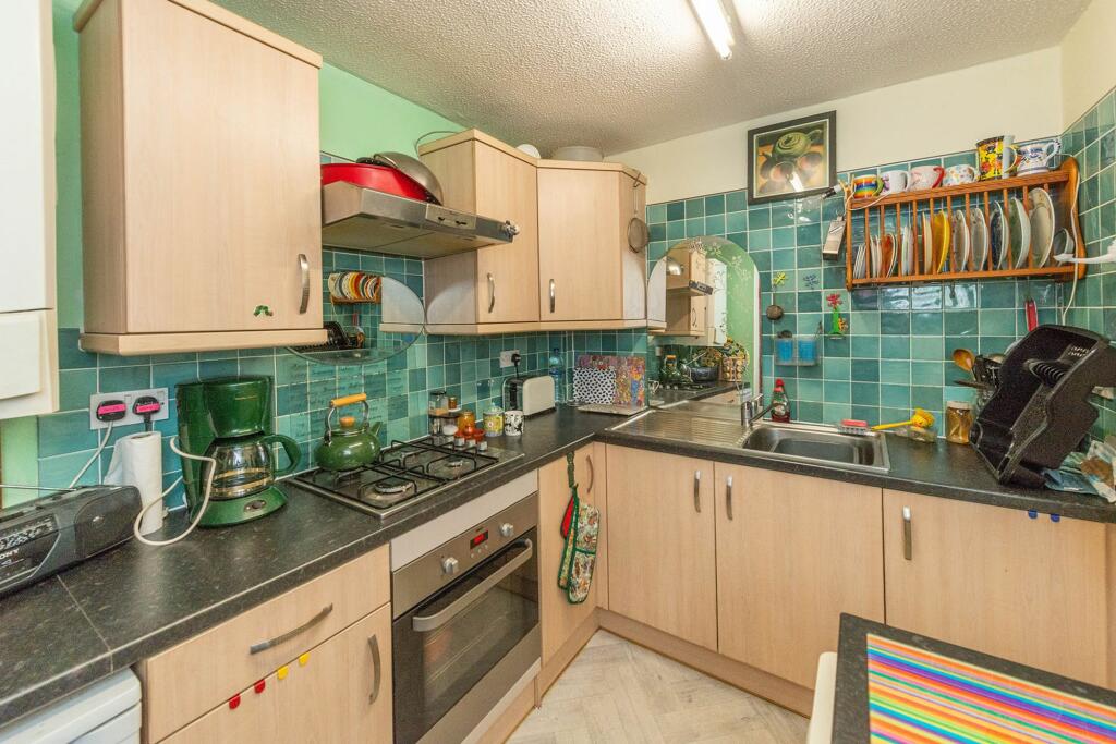 SITTING ROOM DINING AREA AND KITCHEN