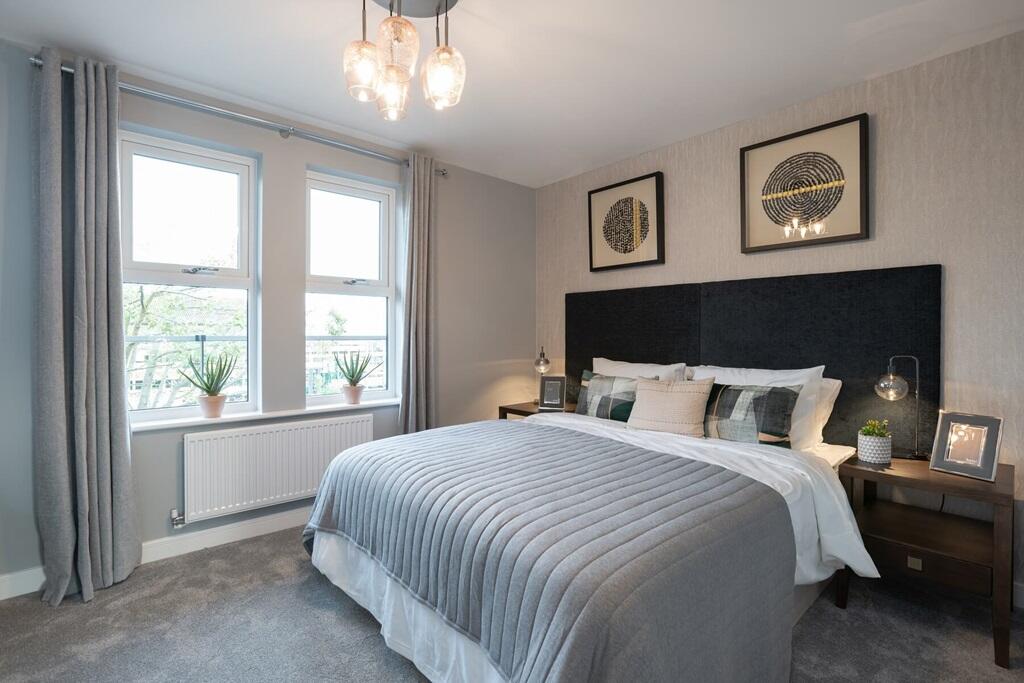 The spacious bedroom offers the perfect space to relax