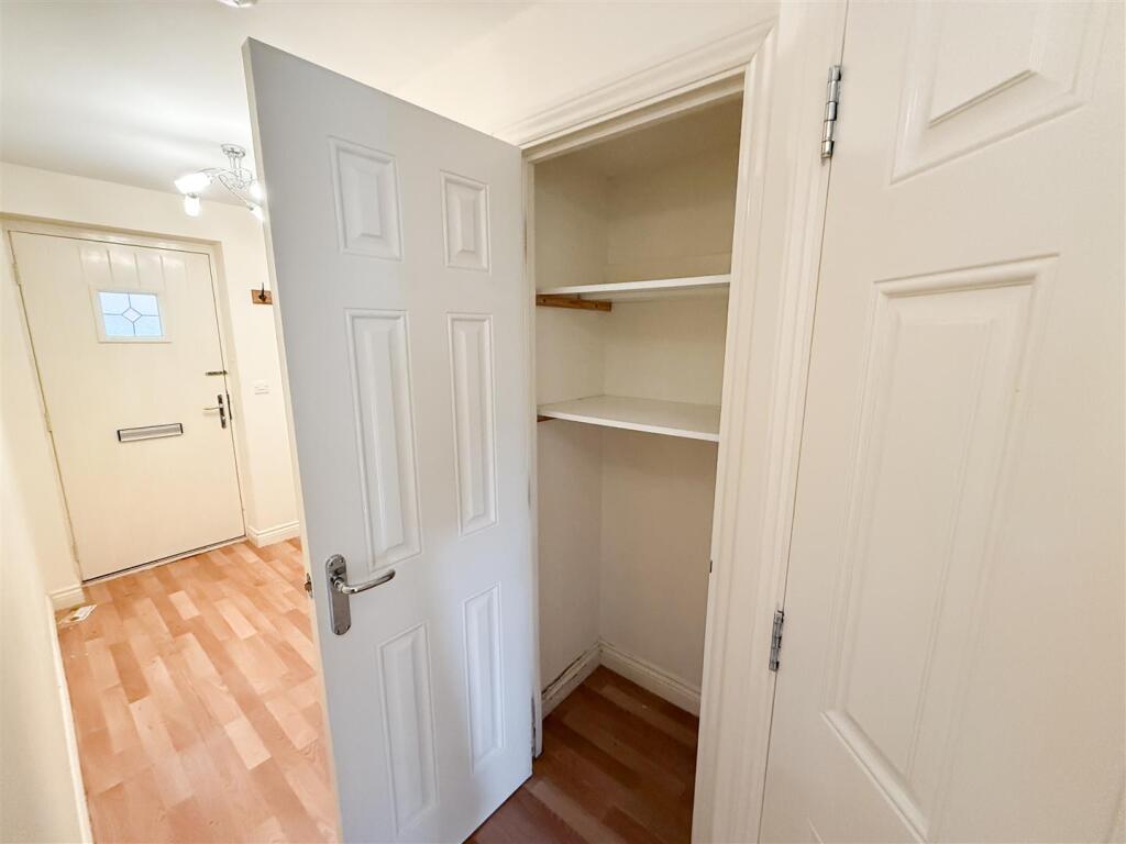 Entrance Storage Cupboard.