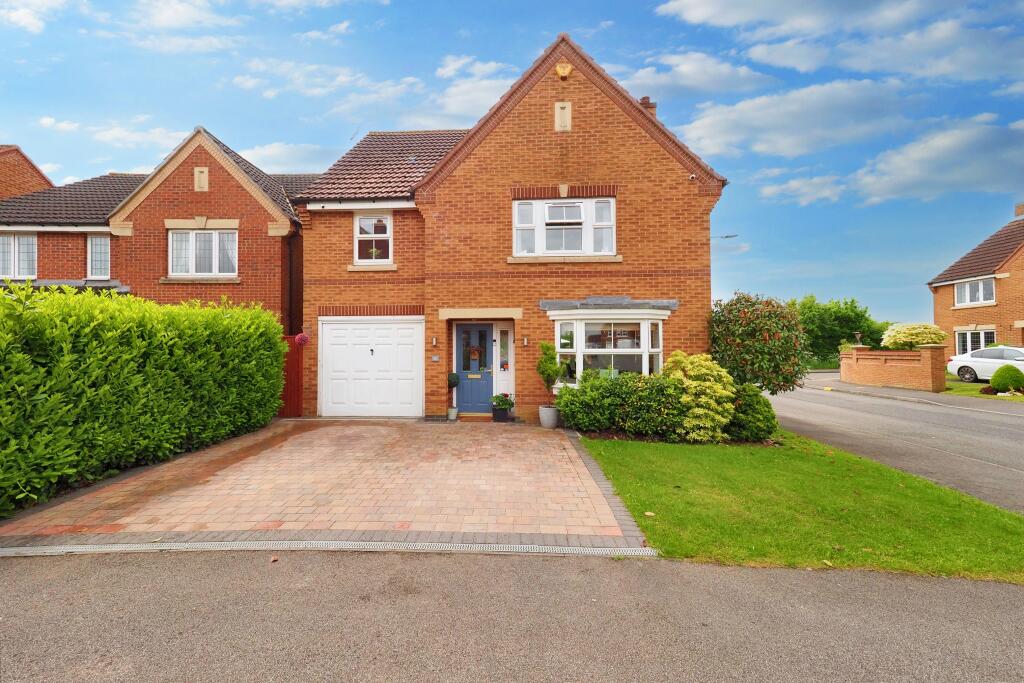 Double Driveway, front garden and garage.