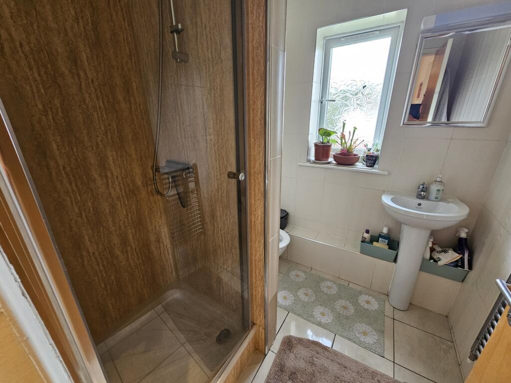 A bright and well-maintained bathroom featuring...