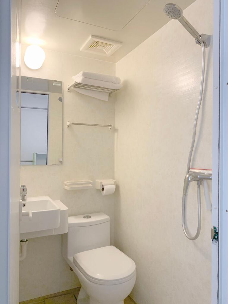 A bright and spotless bathroom featuring a mode...