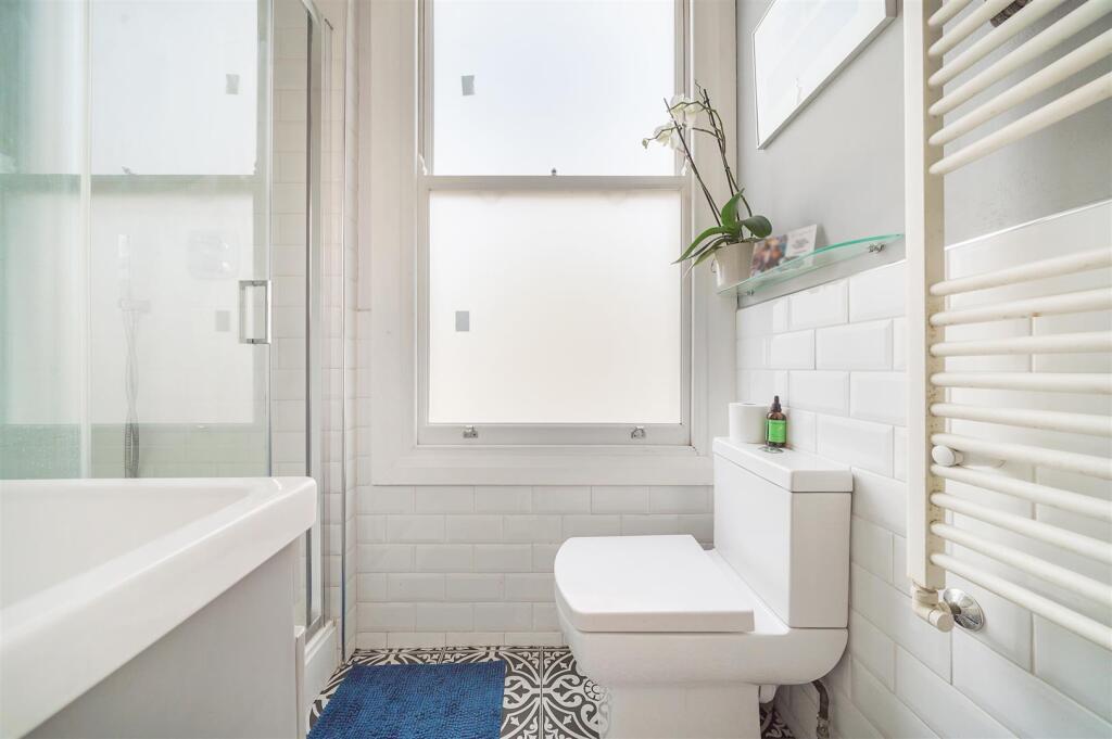 Modern fitted shower room combined W.C