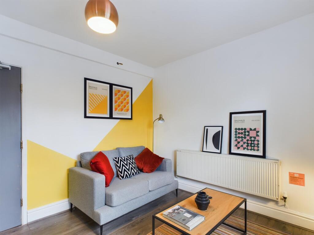 A stylish and inviting living room featuring mo...