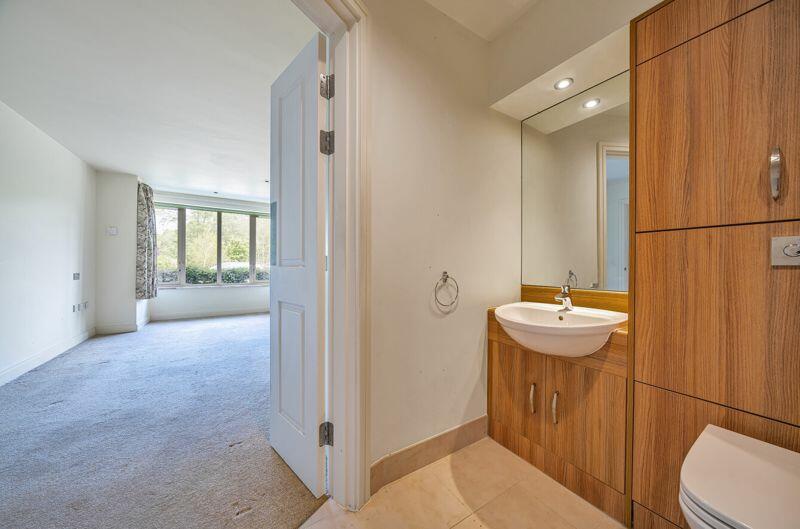 Master bedroom with fitted wardrobe a...