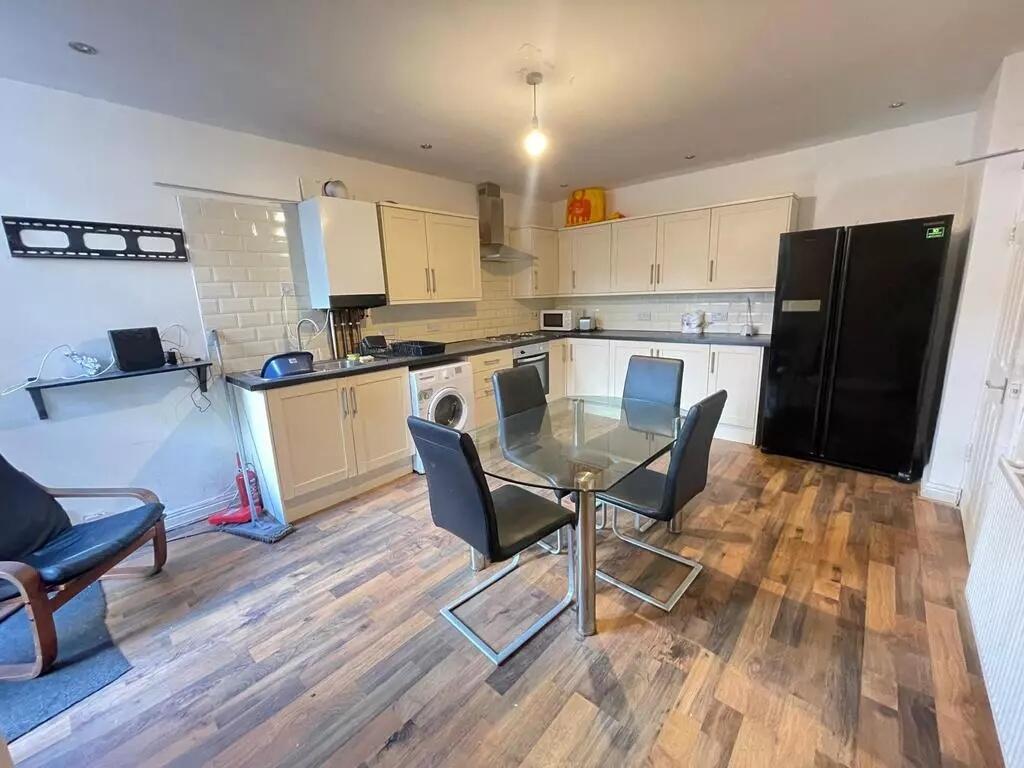 Bright and modern kitchen featuring a spacious ...