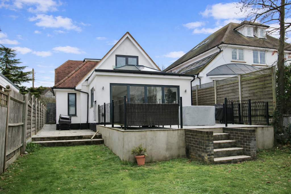 Modern suburban home with patio garden.png